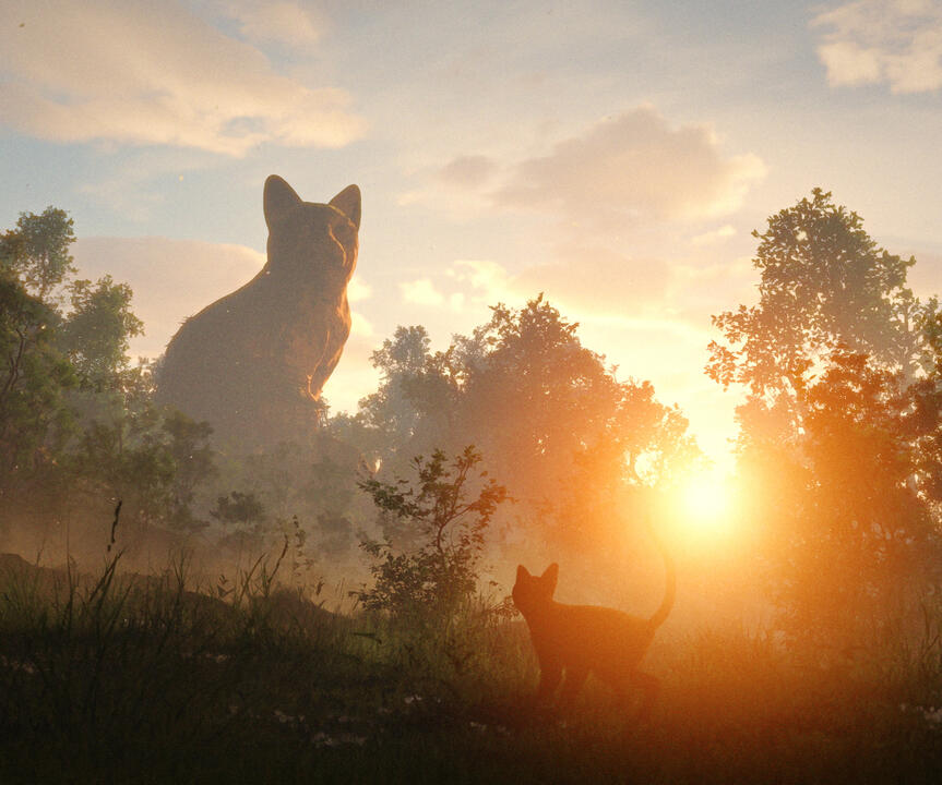A small black cat looks at a giant cat statue on the horizon, silhouetted against the sunset.